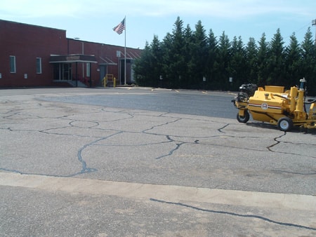 Sealcoating an industrial parking lot