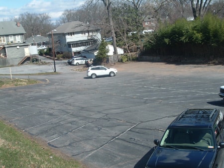 Residential parking lot before asphalt repair